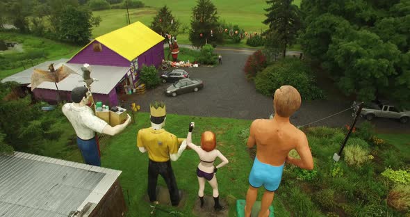 Fly over with camera tilting from horizon to straight down to reveal collection of giant American ro alt