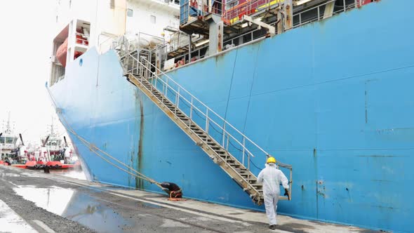 Covid Hazmat Suit Worker Boards Cargo Ship Vessel