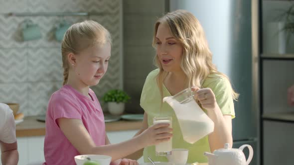 Mother and Daughter Enjoying Family Breakfast