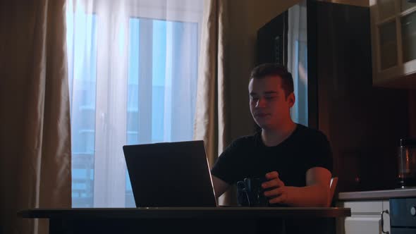 Working in the Morning  a Man Working on His Laptop alt