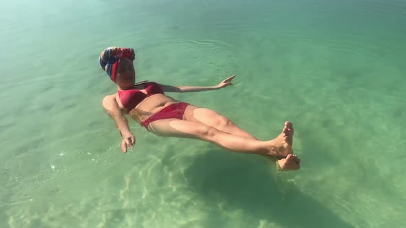 Woman Swimming in a Dead Sea, Funny, Laying on Back, Travel Shots on Mobile Phone