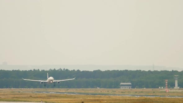 Passenger Plane Landing at the Airport alt