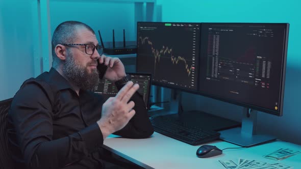 Stock Broker or Trader Talking Animatedly on the Phone alt