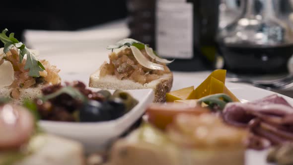 Bruschetta Italian Toasted Bread with Prosciutto Olives Tomato and Cheese Top Viewv in Moder alt