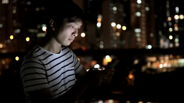 Asian man use of smart phone alt