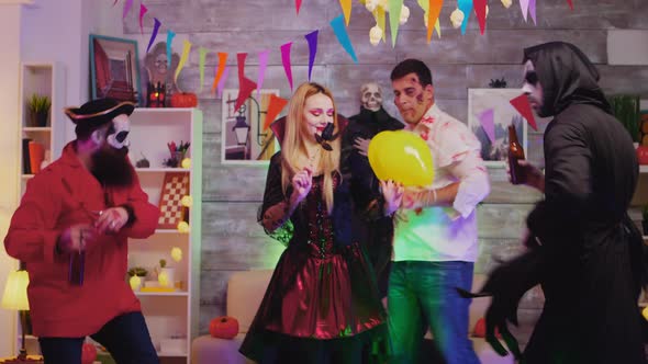 Woman Dressed Up Like a Witch Arriving with Pizza alt