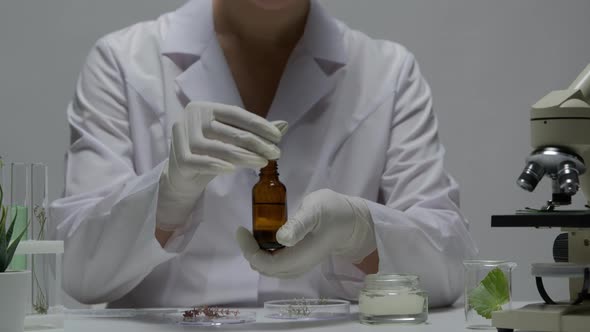 Closeup Scientist Testing Active Cosmetic Ingredients in Clinic Laboratory