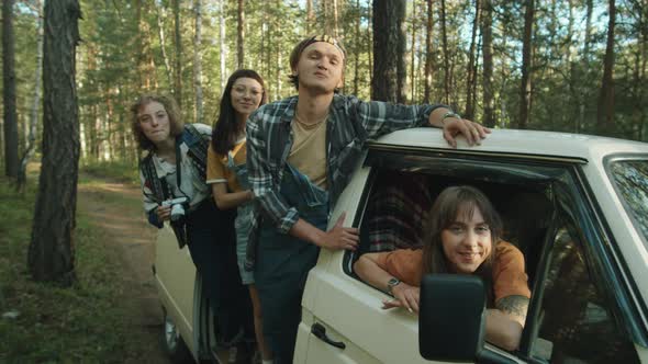 Young Friends Posing for Camera in Travel Trailer alt