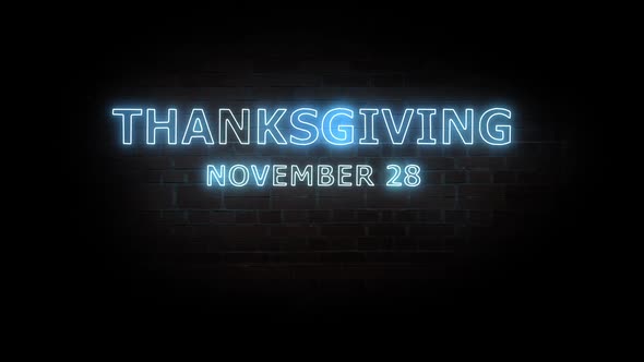 Thanksgiving. Text neon light on brick wall background.