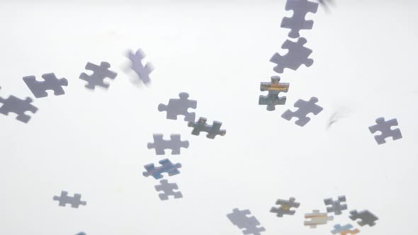 Puzzle Pieces Falling Down. Glass Transparent Background. Pieces of Puzzle Falling Down. Conceptual