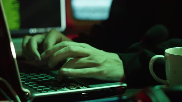 Professional Hacker Typing on Keyboard at Night Closeup of Man Hands Trying to Break Password Using alt