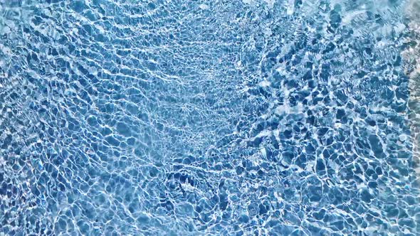 Water Surface Texture Slow Motion Looping Clean Swimming Pool Ripples and Wave Refraction of