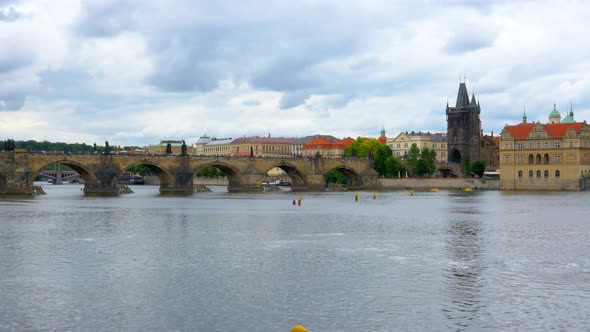 Wide shot of the Charles Bridge and Old Town Bridge Tower in Prague, Czech Republic alt