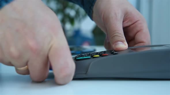 Hand Inserts Credit Card Into Terminal