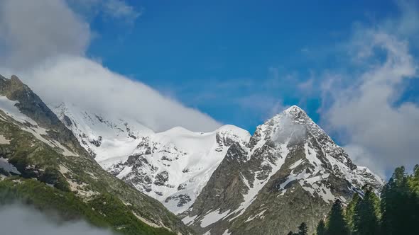 Caucsian Mountain Ridge Covered with Snow on Clear Sunny Day