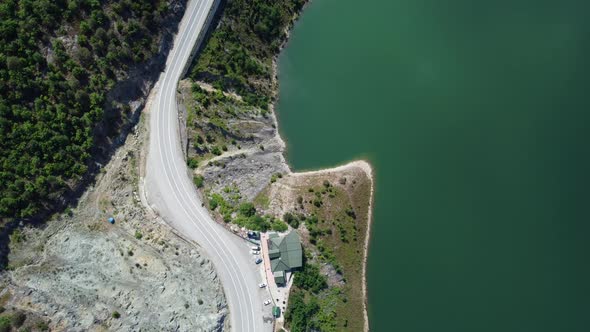 Aerial shot of the road adjacent to the lake