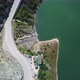Aerial shot of the road adjacent to the lake - VideoHive Item for Sale