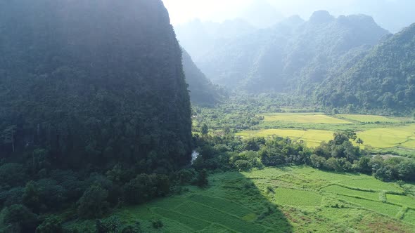 Landscape around the city of Vang Vieng in Laos seen from the sky alt