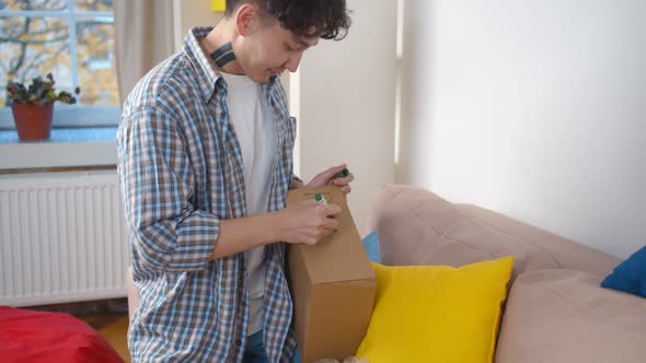 Asian Volunteer Writing Donation on Cardboard Box To Pack Food alt