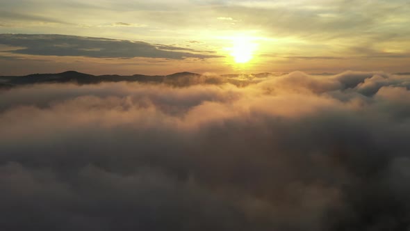 Above Clouds and Sunrise