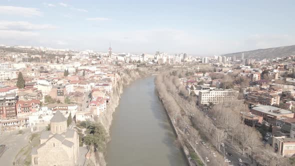 Aerial view of Metekhi church in old Tbilisi located on cliff near river Kura. Georgia 2021 Spring alt