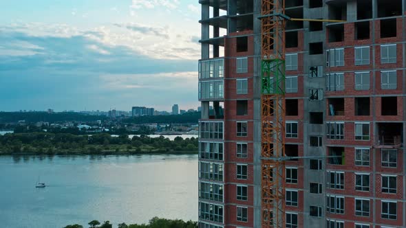 Aerial Vertical Flight Along Construction of Multistorey Building alt