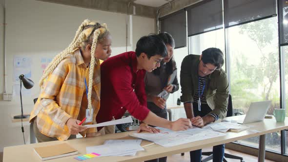 Meeting of UX developer and UI designer brainstorming about mobile app interface alt