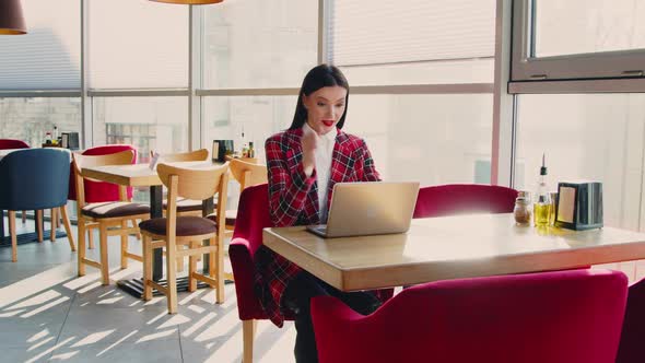 Business Woman Is Working Remotely On Laptop