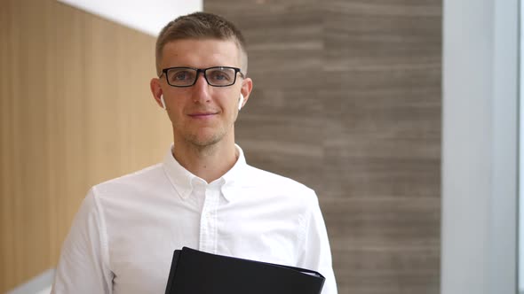 Portrait Of Successful Businessman Entrepreneur Wearing Wireless Earphones alt