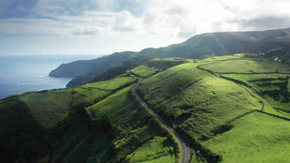Aerial View of the Scenic Road Cascading Along the Cliffs alt