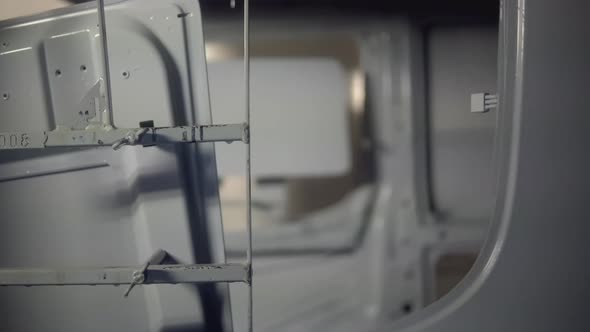 Robots at the Factory Paint the Cab of the Car alt