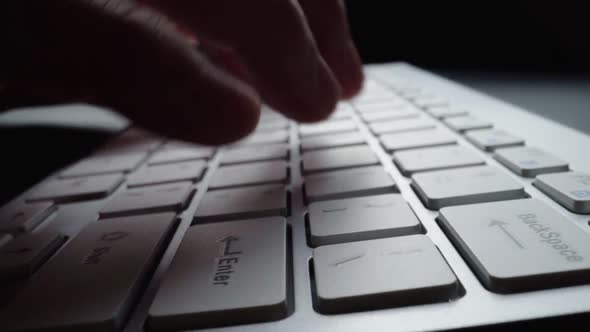 Close-up time lapse typing on keyboard with fingers. Macro soft focus dolly shot alt