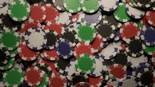 Jackpot. Casino chips formed a big pile on a gaming poker table. Loopable video alt