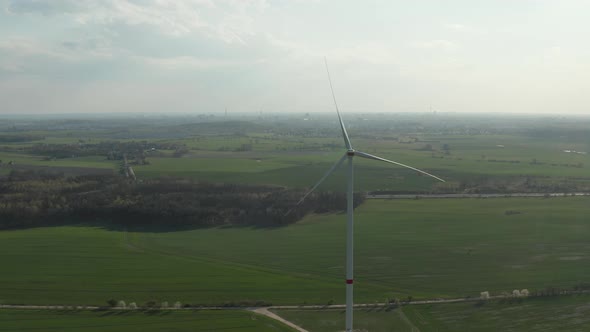 Wind Turbine Towering High Above Spring Countryside alt