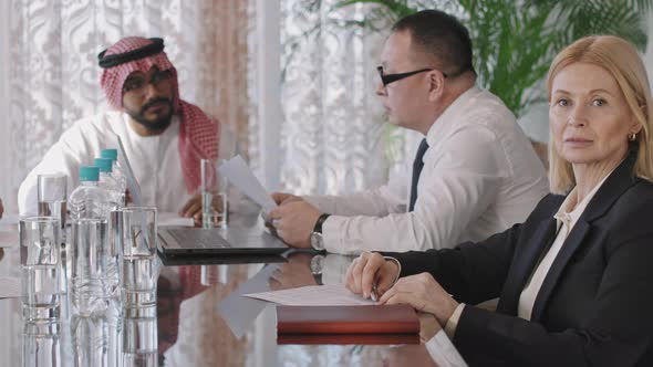 Confident Female Investor At Business Conference alt