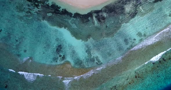 Daytime drone tourism shot of a white paradise beach and blue ocean background in high resolution  alt