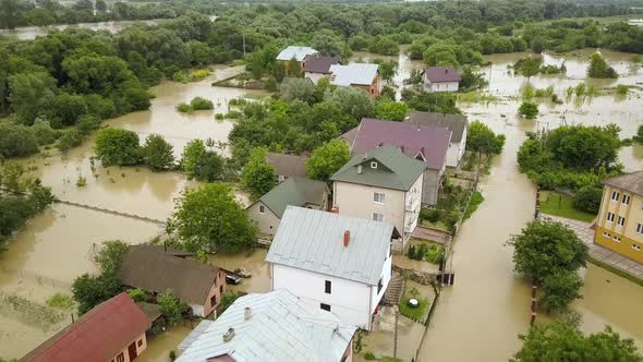 Aerial view of flooded houses with dirty water of Dnister river in Halych town, western Ukraine. alt
