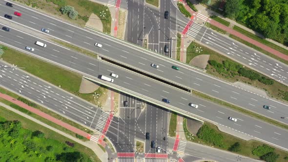 Highway aerial with cars and truck lorrying aerial view 4k. Four lane local road traffic transport v alt
