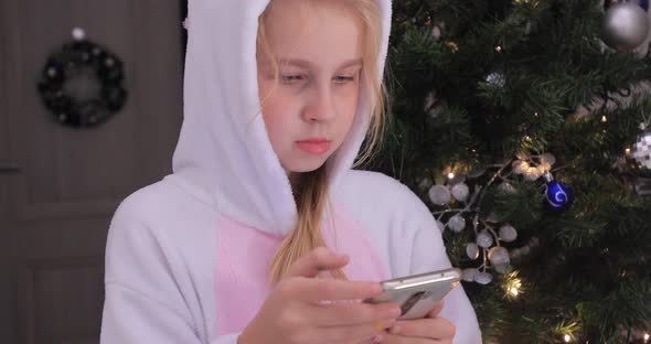 Baby Girl with Christmas Phone