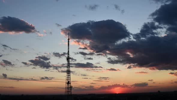 Time Lapse of Dramatic Sky and Moving Purple Clouds and 5G Communication Tower
