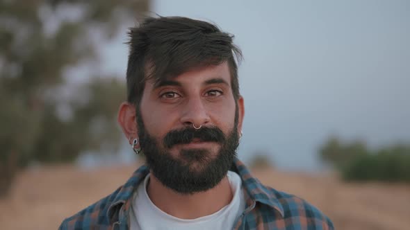 Portrait of a confident bearded smiling alt