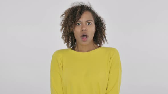Young African Woman Feeling Shocked on White Background alt