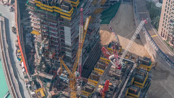 Construction of New Modern Skyscraper in Dubai City Aerial Timelapse United Arab Emirates alt