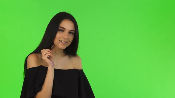 Gorgeous Elegant Woman in Black Dress Posing Seductively at Studio alt