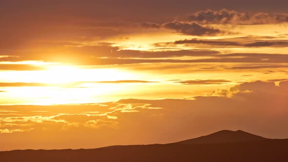Evening Clouds Over Mountains alt