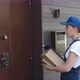 Young Delivery Person Entering House with Parcels - VideoHive Item for Sale