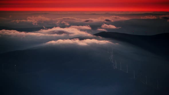 Wind Turbines At Sunset Above Clouds, Portugal.