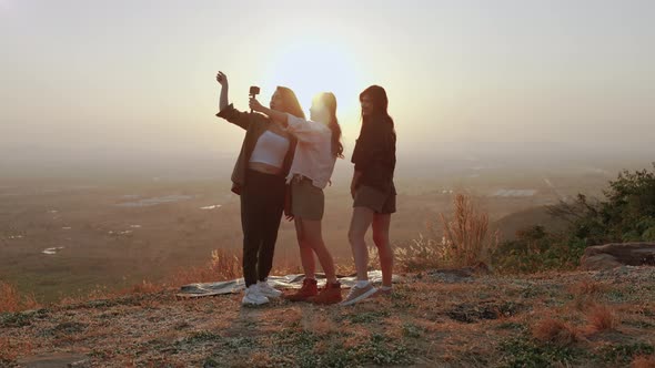 girl friend group Asians blogger standing and caper enjoying the beauty of nature