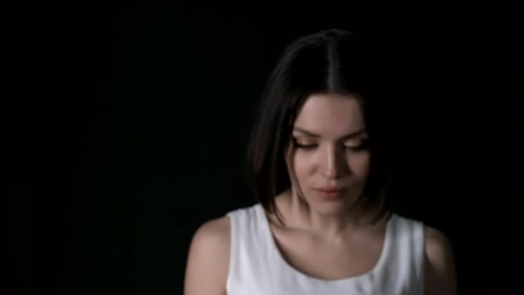 Beautiful Woman on Dark Background alt