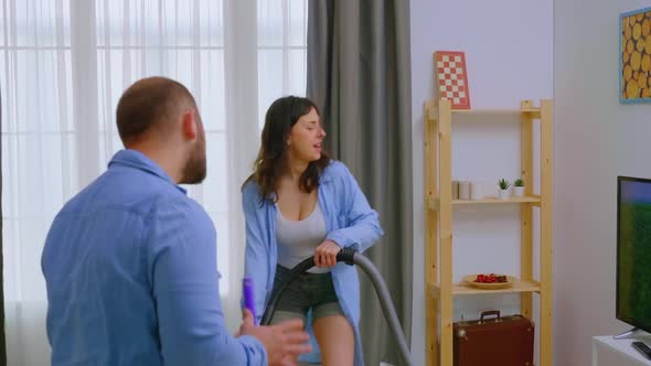 Woman Dancing with the Vacuum Cleaner alt